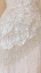 Close up of intricate sequin and pearl beadwork on bodice
