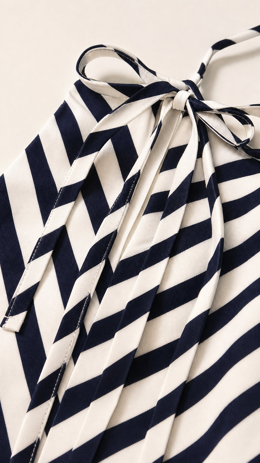 Close-up detail of halter neck tie and chevron stripe fabric