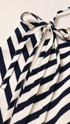 Close-up detail of halter neck tie and chevron stripe fabric