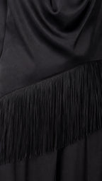 Close-up detail of fringe trim on black satin jumpsuit