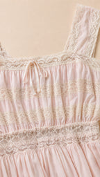 Close-up detail of bodice and lace trim on pink dress