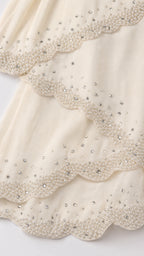 Close up detail of beaded scalloped tiers
