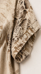 Close-up detail of soft patterned fabric and short sleeve