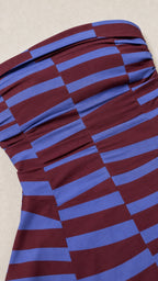 Close-up detail of the striped strapless top construction