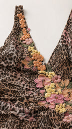 Close-up detail of 3D floral embroidery and V-neckline