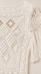 Close-up detail of upper bodice and fringe sleeves