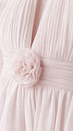 Close-up detail of front bodice rosette and chiffon pleats on pink dress