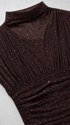 Close-up detail of mock neck and sparkly fabric texture