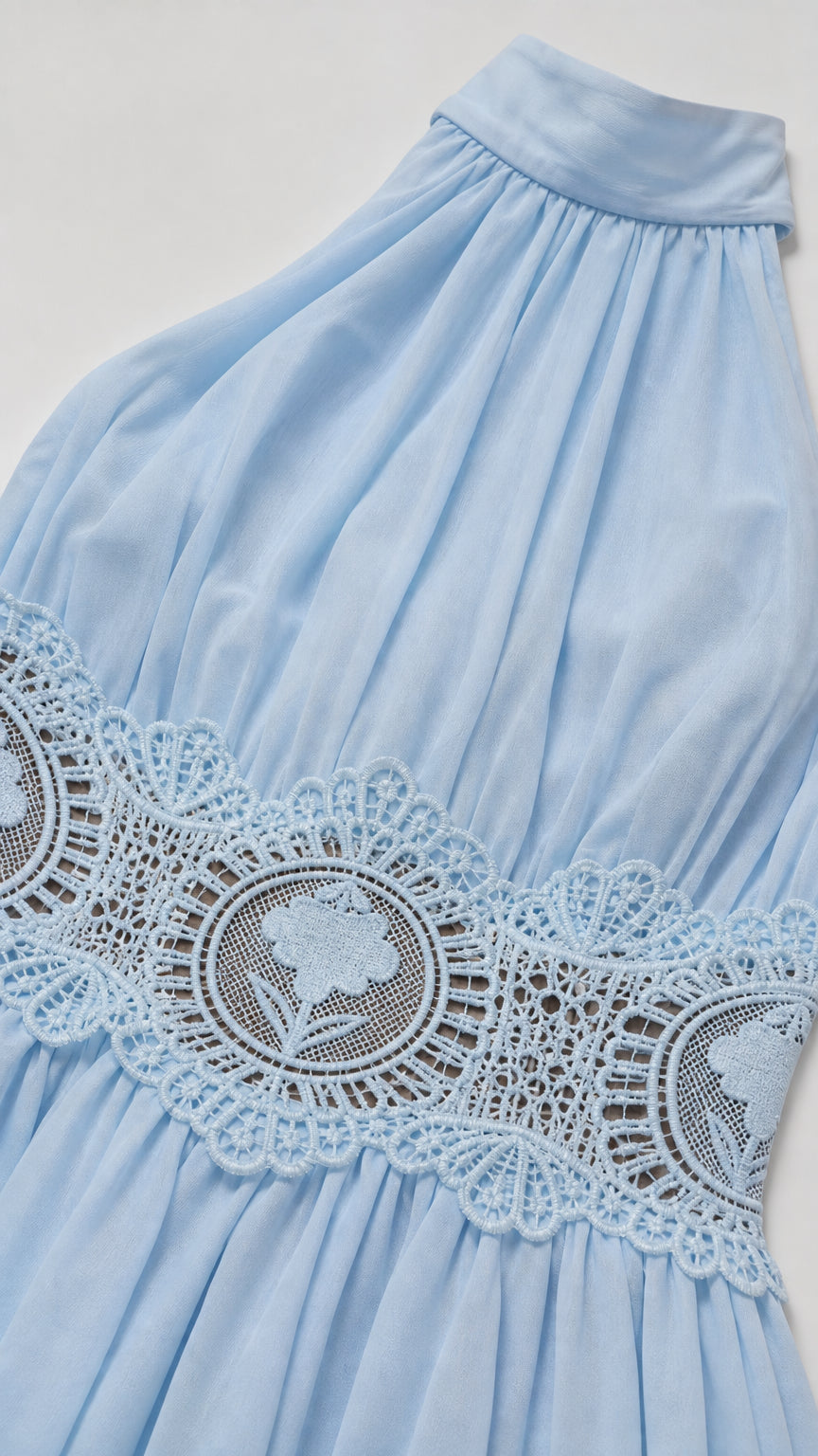 Close-up of fabric texture and floral crochet waist