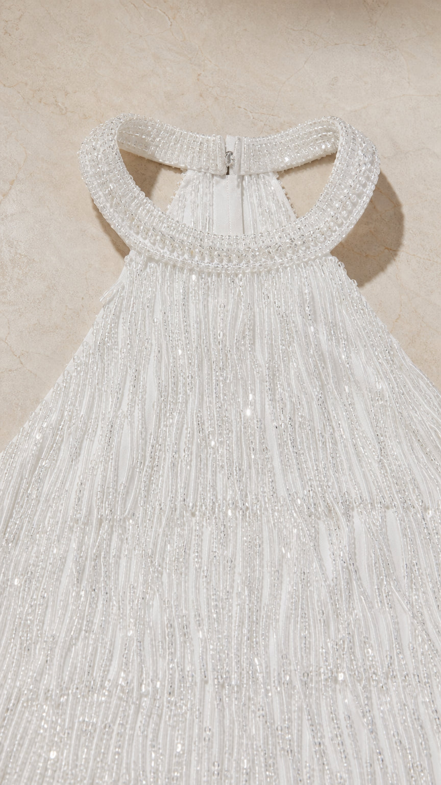 Close-up of beaded halter neckline and fringe texture