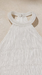 Close-up of beaded halter neckline and fringe texture