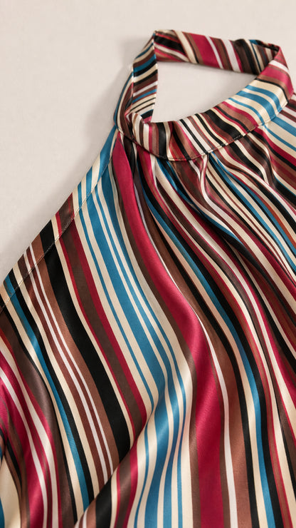 Close-up detail of the satin-finish halter neckline and multi-color stripes