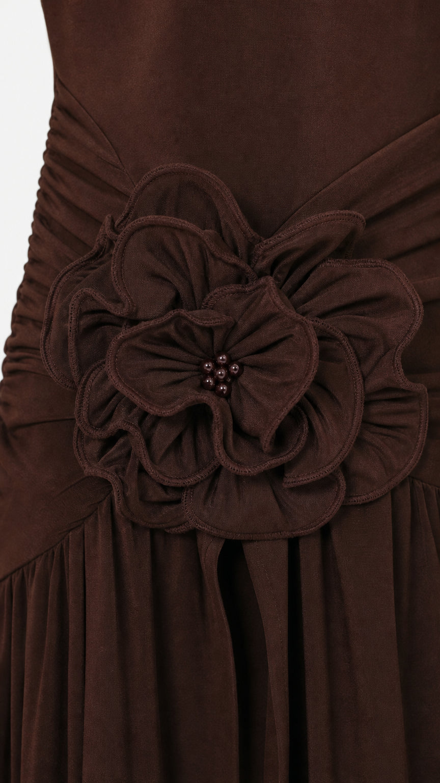 Close-up detail of the 3D fabric rose applique on the waist