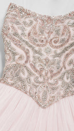 Close-up of intricate silver and pink beadwork on the bodice