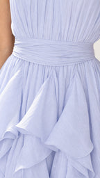 Close up of draped waist and ruffle detail in light blue chiffon
