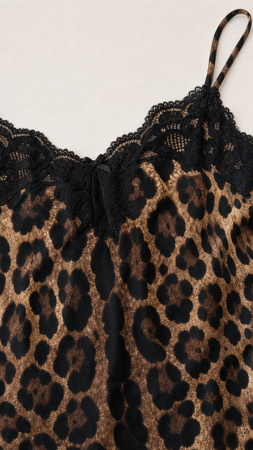 Close-up detail of lace trim and leopard print fabric