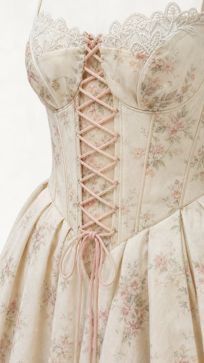 Close-up detail of lace-up corset bodice and floral print