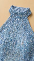 Close-up detail of halter neckline and beadwork