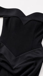 Close-up detail of black off-the-shoulder sweetheart neckline and bodice