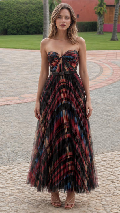 Model wearing black patterned pleated strapless maxi dress