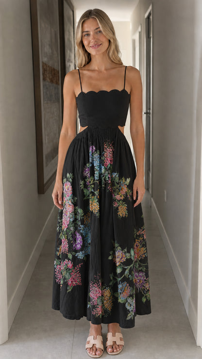 Woman wearing black floral cutout midi dress