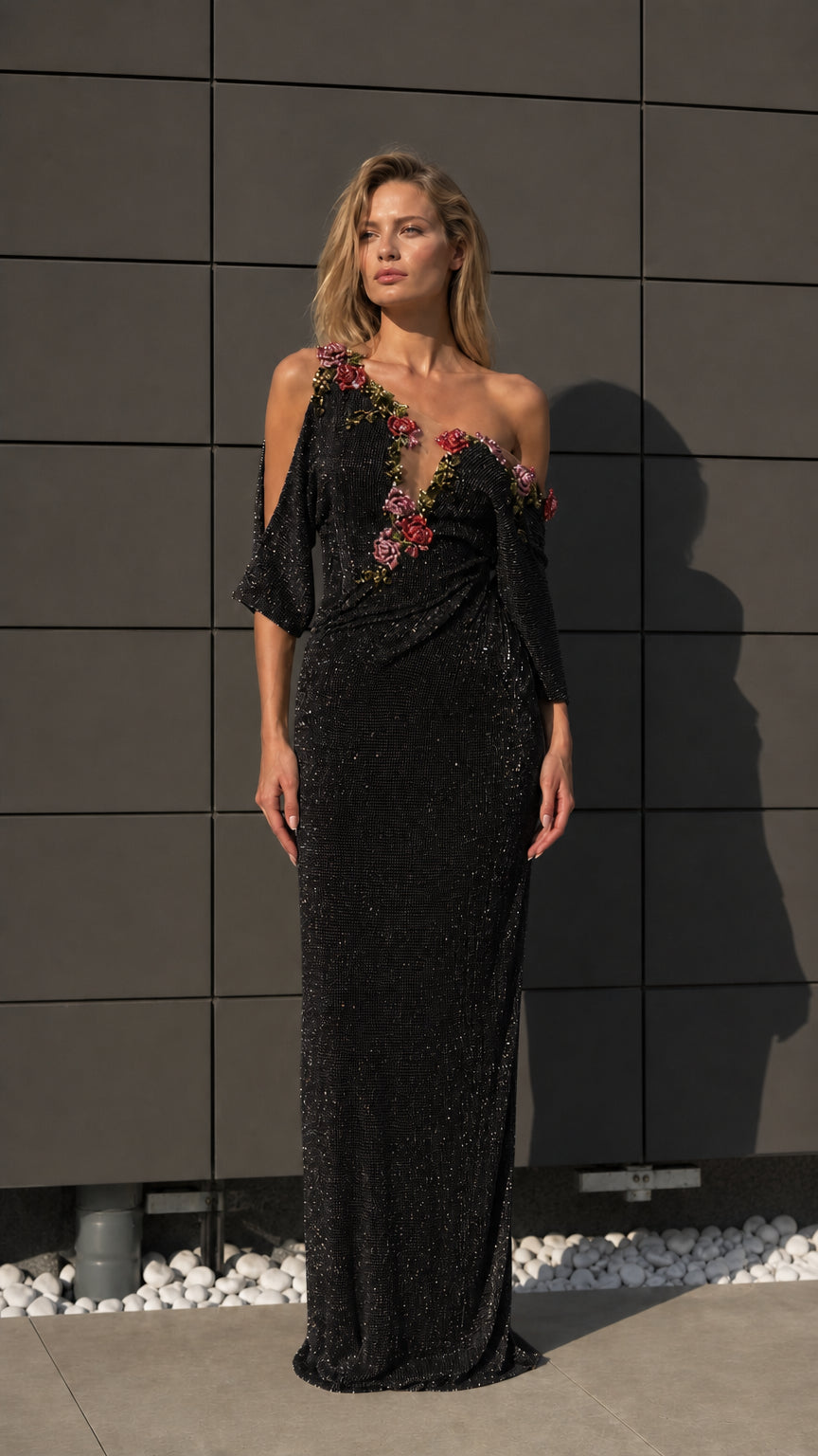 Front view of black one-shoulder beaded evening dress