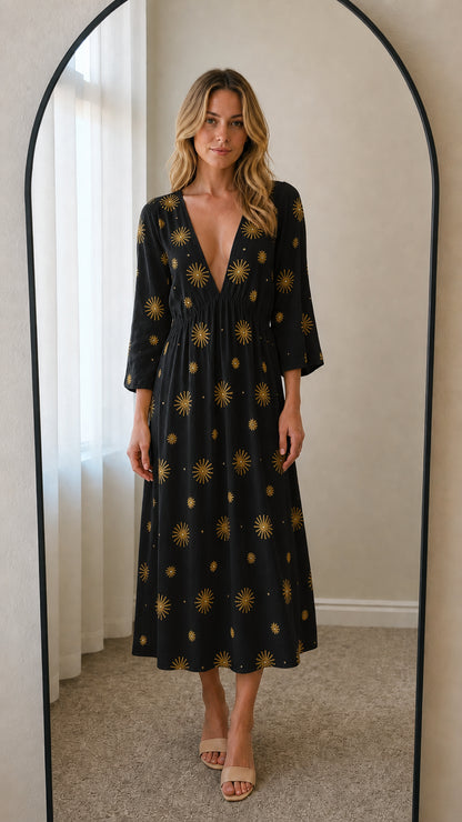 Front view of black embroidered midi dress
