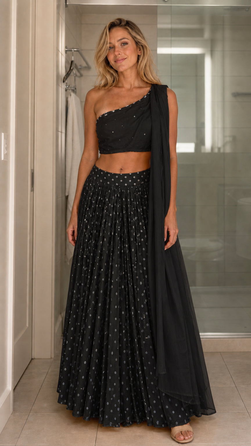 Front view of model wearing black two-piece set