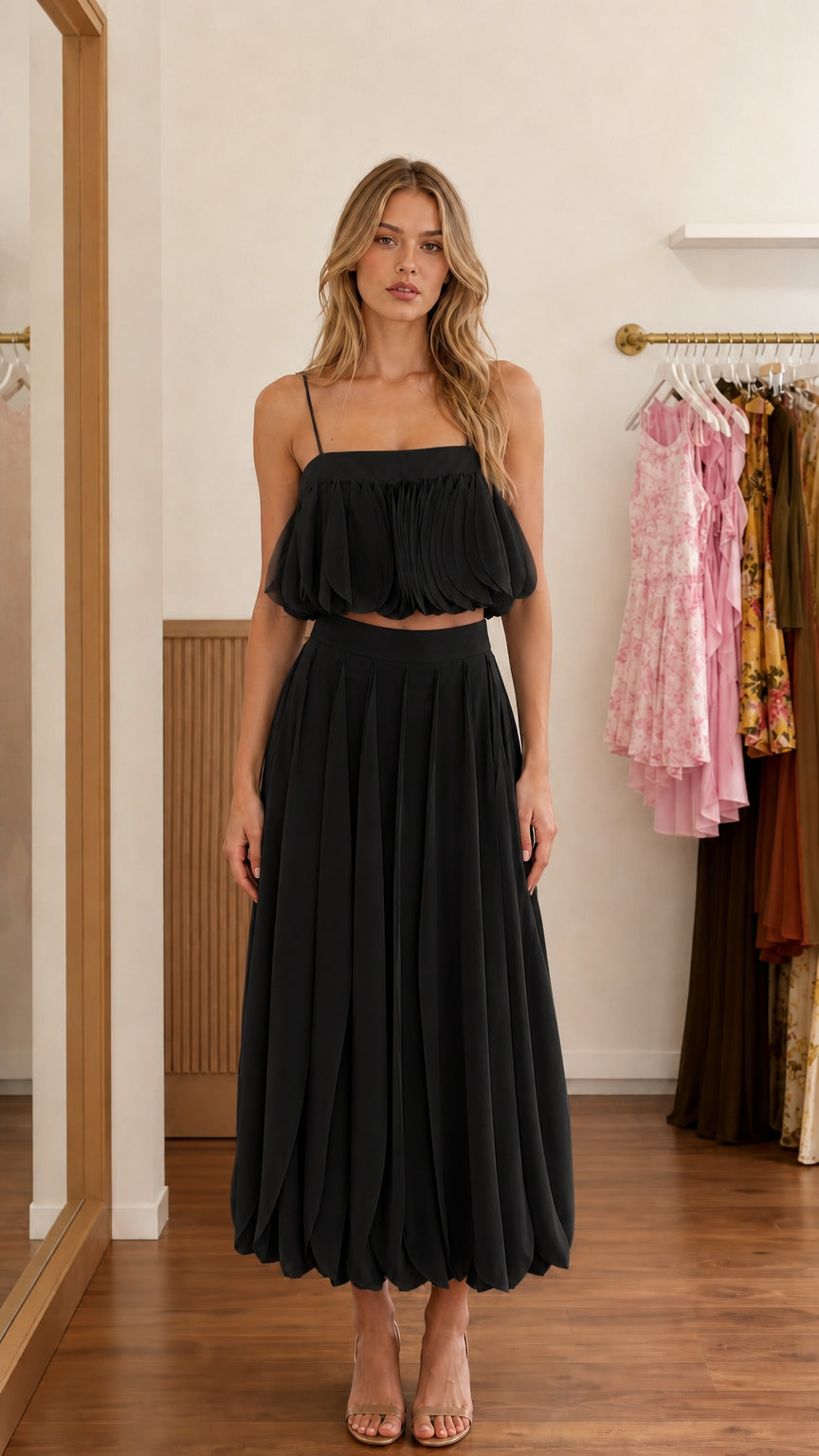 Front view of black two-piece set on model