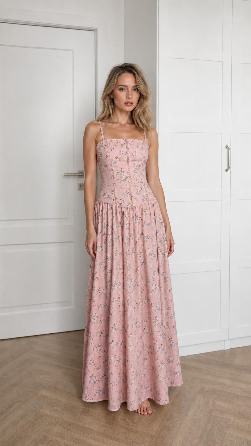 Front view of woman wearing pink floral maxi dress
