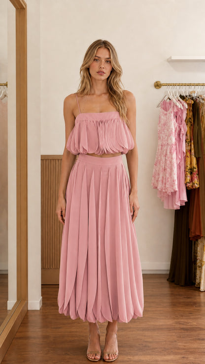 Front view of pink two-piece set on model