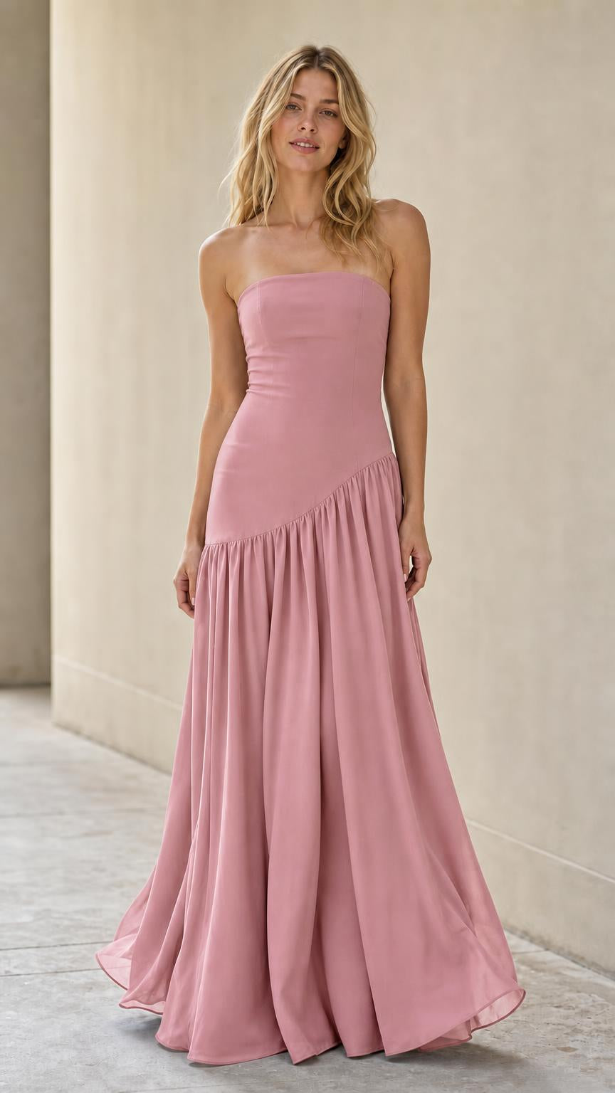 Full length view of model in pink strapless drop-waist dress