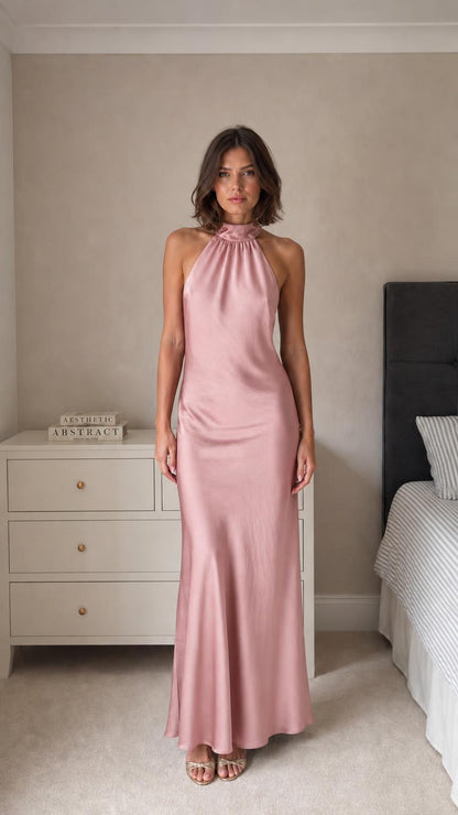Model wearing dusty pink satin halter neck maxi dress