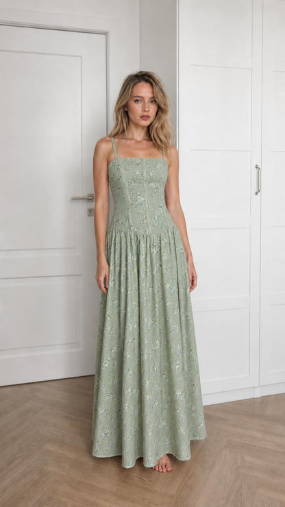 Front view of woman wearing sage green floral maxi dress