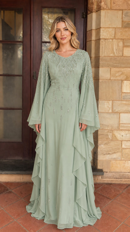 Model wearing sage green beaded long sleeve maxi dress