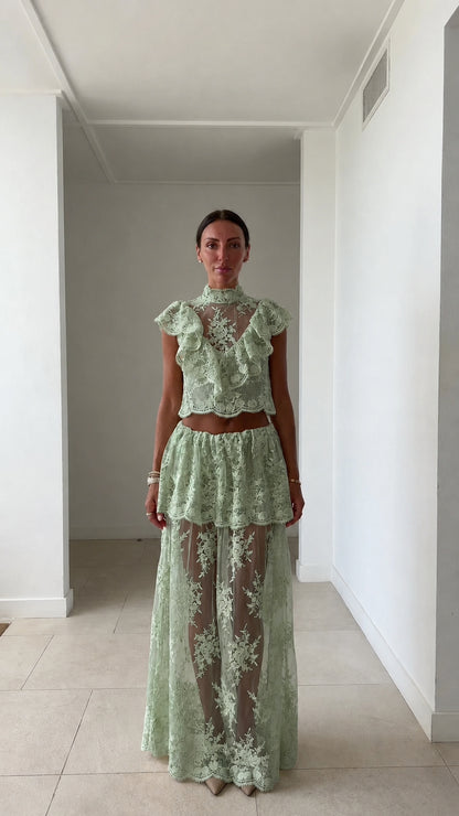 Model wearing sage green lace two-piece set