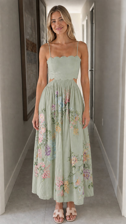 Woman wearing sage green floral cutout midi dress