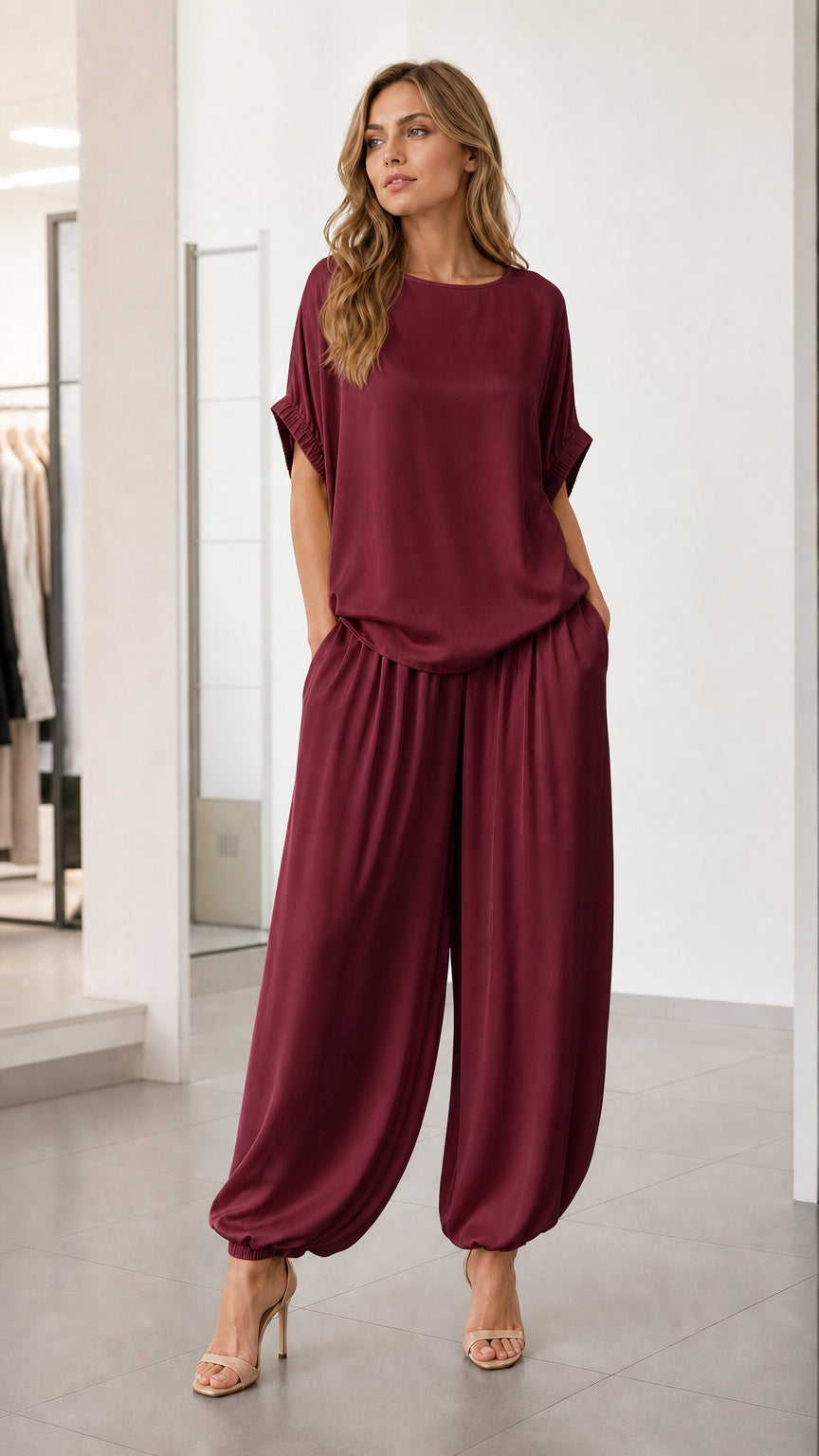 Front view of model wearing burgundy two-piece lounge set