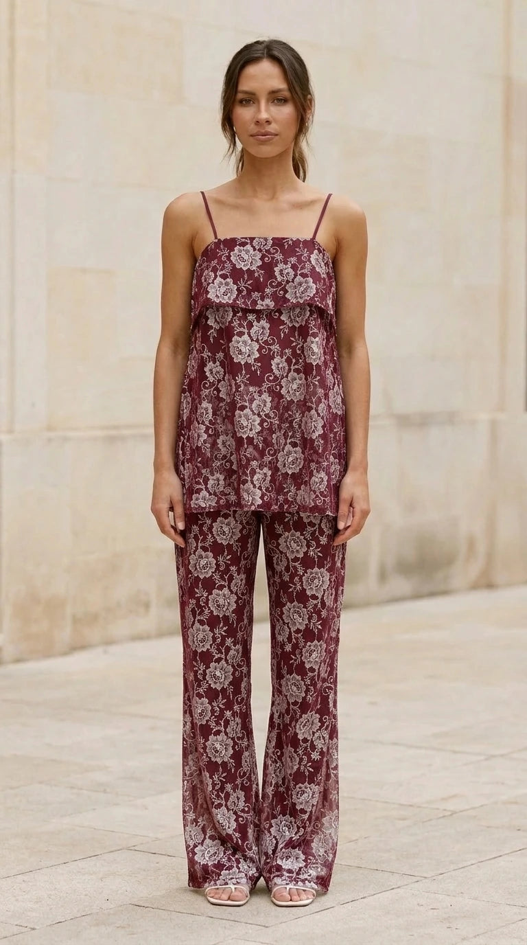 Model wearing burgundy lace cami top and matching pants
