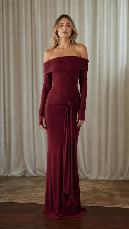 Front view of woman wearing burgundy off-shoulder maxi dress