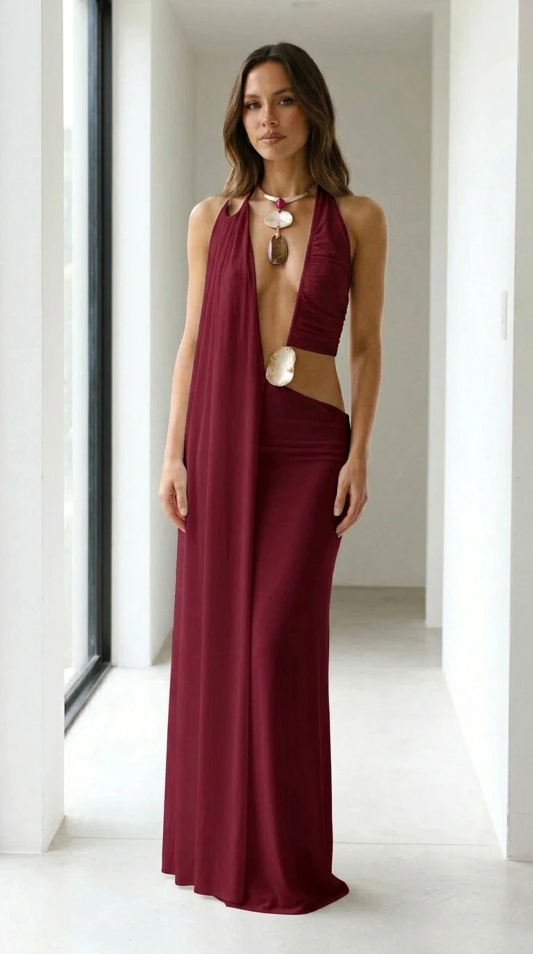 Front view of woman wearing burgundy drape halter maxi dress