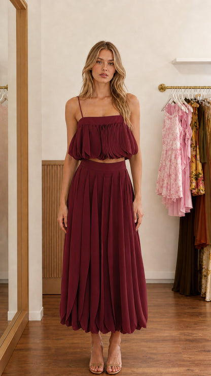 Front view of burgundy two-piece set on model