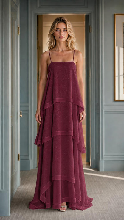 Front view of woman wearing burgundy tiered maxi dress