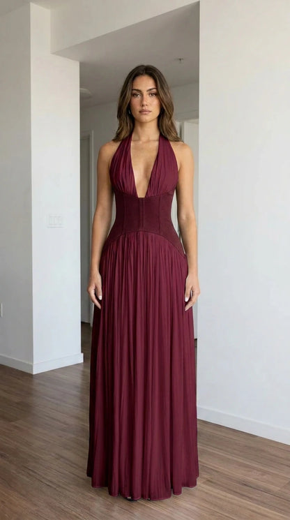 Front view of burgundy halter pleated maxi dress