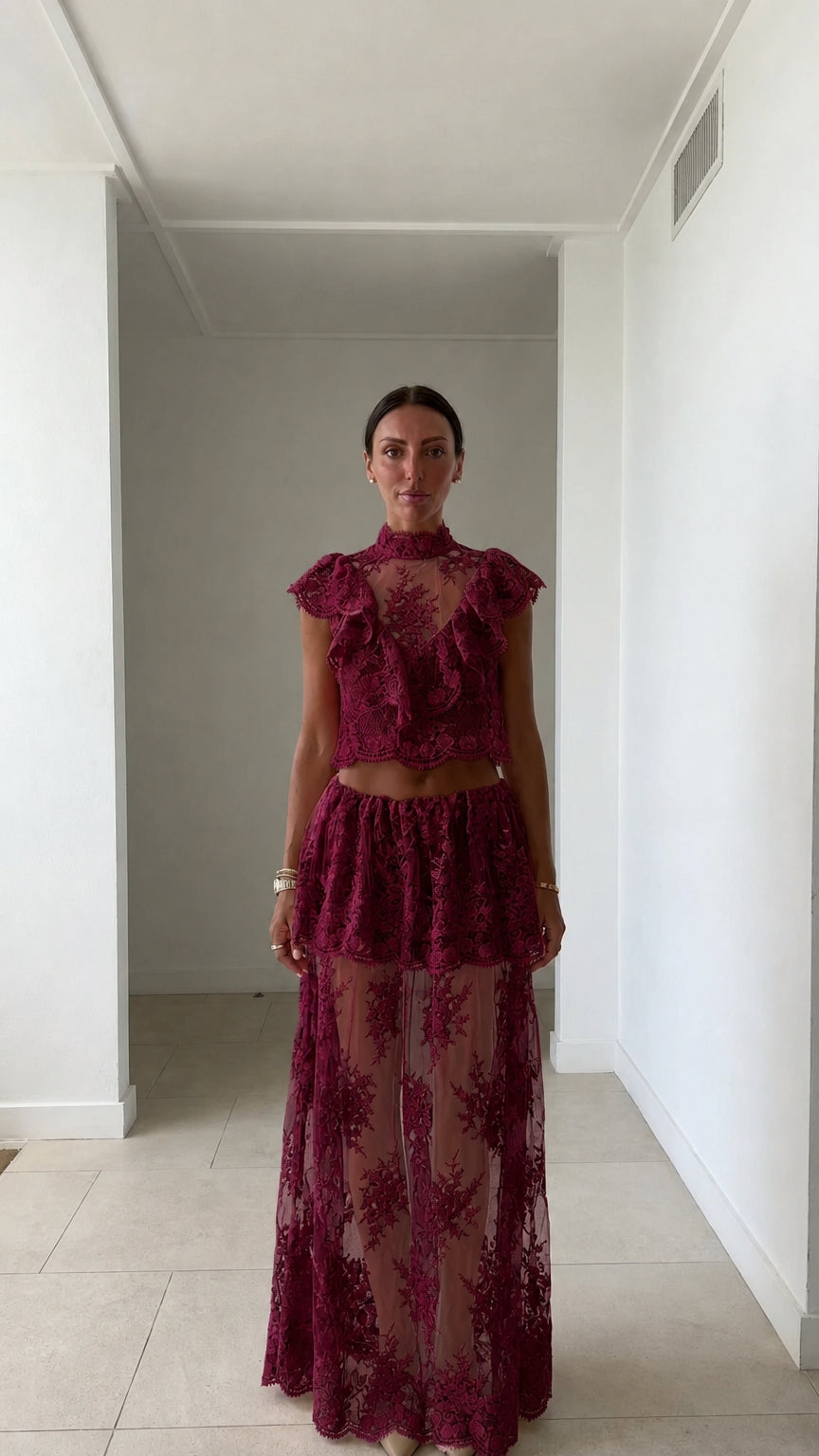 Model wearing burgundy lace two-piece set
