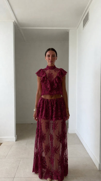 Model wearing burgundy lace two-piece set