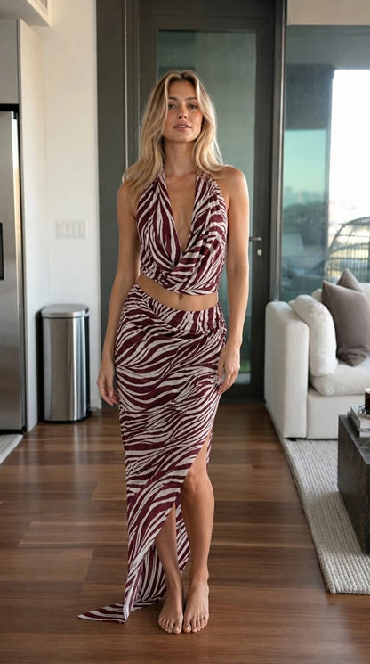 Front view of woman wearing burgundy zebra print matching set