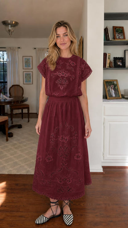 Woman wearing burgundy embroidered short sleeve midi dress