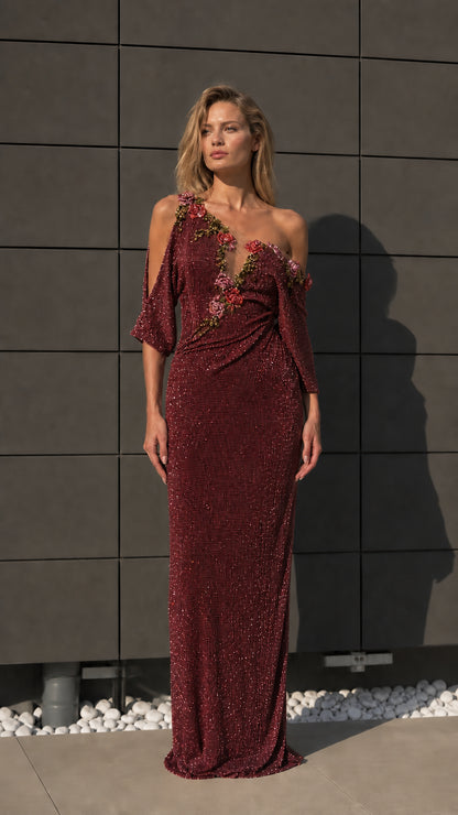 Front view of burgundy one-shoulder beaded evening dress