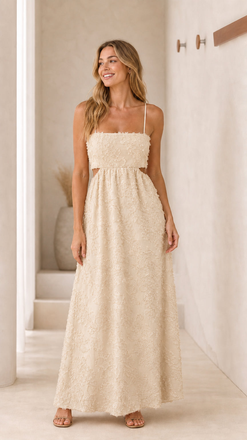 Front view of cream textured cutout maxi dress